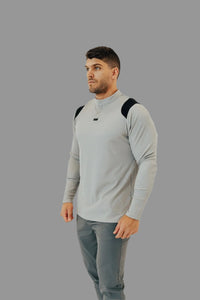 Ghost Grey long sleeve golf shirt with black yoke and button placket, charcoal pants