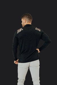 Back view of the Black/Camo long sleeve golf shirt showing camo panels across the shoulders