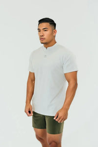 Blizzard White men's short sleeve golf shirt with a stand collar, front view