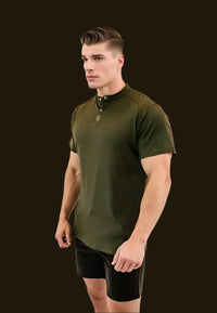 Seaweed Green golf shirt with black shorts, fitted cut, dark backdrop
