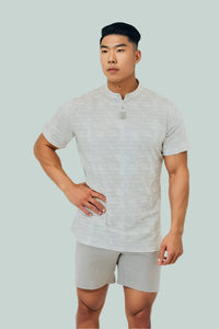Snowstorm men's short sleeve golf shirt, hand on hip, front view