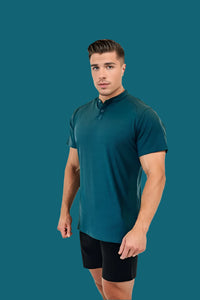 Three-quarter view of the Titan Blue golf shirt, fitted through the arms