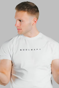 Man wearing a Blizzard White short sleeve training shirt, profile view with face