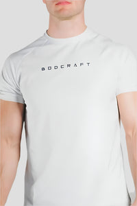 Close-up of the BODCRAFT chest logo on a Blizzard White short sleeve workout shirt