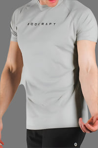 Man wearing a Sandstone Grey short sleeve training shirt, front torso view
