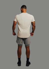 Back view of Ghost Grey Ai1 lined training shorts and sand tee