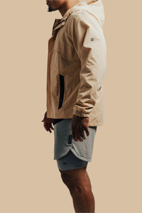 Side view of the King's Gold Ai1 Stealth full-zip with grey shorts