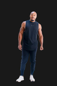 Men's sleeveless workout shirt in Midnight Black by BodCraft, cool-touch fabric with a scalloped hem