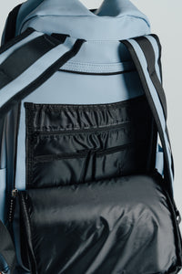 Inside the Carolina Blue Ai1 backpack: black-lined organizer pockets and laptop sleeve