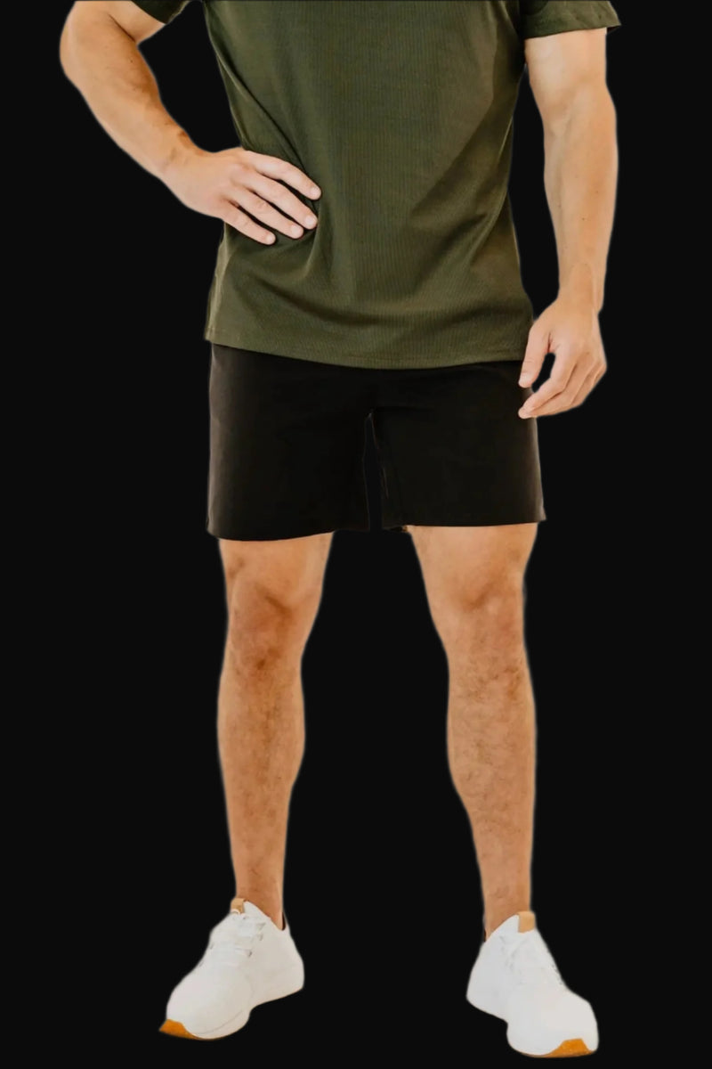 Men's 6 inch inseam golf shorts in Midnight Black by BodCraft, cut to sit above the knee