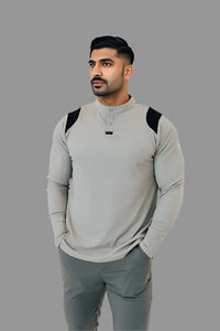 Ghost Grey/Black long sleeve golf shirt worn with charcoal pants, front view