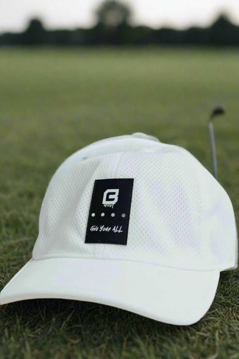 Adjustable golf hat in Blizzard White by BodCraft, woven with a PU leather tag