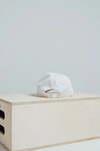 Back of the Blizzard White Give Your All golf hat with adjustable closure