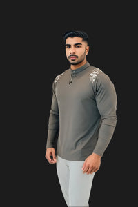 Storm Grey long sleeve golf shirt with camo yoke, hand in pocket, three-quarter view