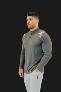 Storm Grey long sleeve golf shirt with camo shoulder panels, worn with light grey pants