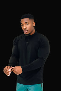 Close-up of the All Black long sleeve golf shirt's collarless henley neckline