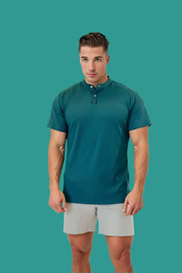 Pine Green men's short sleeve golf shirt with a stand collar, light grey shorts