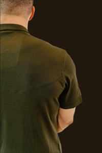 Shoulder and sleeve detail on the Seaweed Green golf shirt's knit fabric