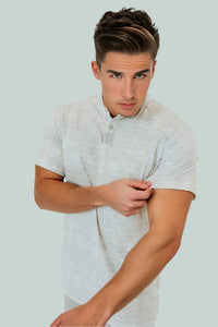 Close-up of the Snowstorm golf shirt's mottled off-white print and stand collar
