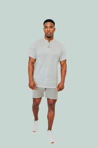 Full-length: Snowstorm off-white short sleeve golf shirt with light grey shorts