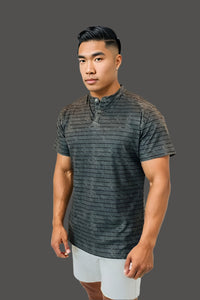 Volcanic Ash short sleeve golf shirt with a tonal stripe print and button placket