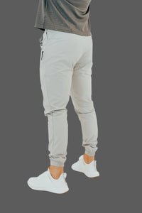 Side view of light grey golf joggers with elastic ankle cuffs