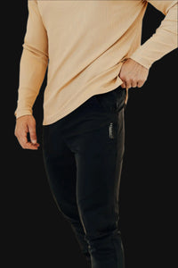 Midnight Black men's golf joggers, hand in the side pocket, woven waist tag