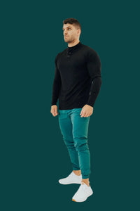 Full-length: black long sleeve golf shirt with Pine Green golf joggers