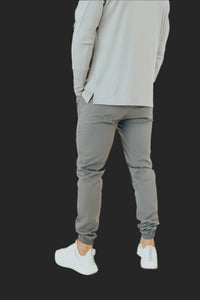 Storm Grey golf joggers from the side, split hem long sleeve shirt above