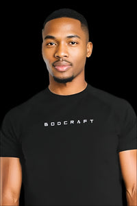 Man wearing a Midnight Black short sleeve training shirt, front view