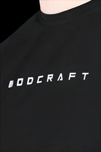 Close-up of the BODCRAFT wordmark print on the Midnight Black short sleeve shirt