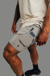 Close-up of a phone in the liner pocket of Ghost Grey Ai1 lined shorts