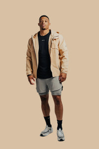 Open King's Gold Stealth full-zip over a black tee, walking