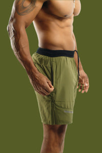 Side zip pocket on Dark Olive 5 inch Battle shorts, three-quarter view