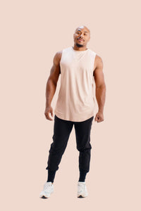 Sleeveless workout shirt in Faded Rose by BodCraft, cool-touch fabric with a scalloped hem