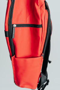 Close-up of the side zip pocket and bottle pocket on the Kingdom Red Ai1 backpack
