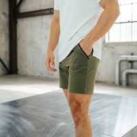 Close-up of the side zip pocket on Dark Olive 6 inch inseam golf shorts